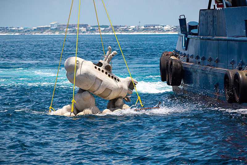 Submerging a new sculpture into Underwater Museum of Art